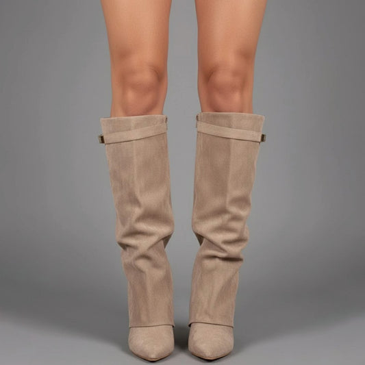 Beige over-the-knee boots with buckle strap and low block heel.