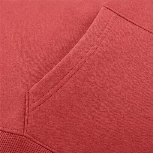 Red sweatshirt sleeve and side seam with stitched edging