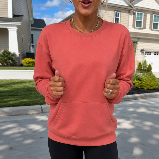 Oversized crewneck sweatshirt in coral red with long sleeves and kangaroo pocket