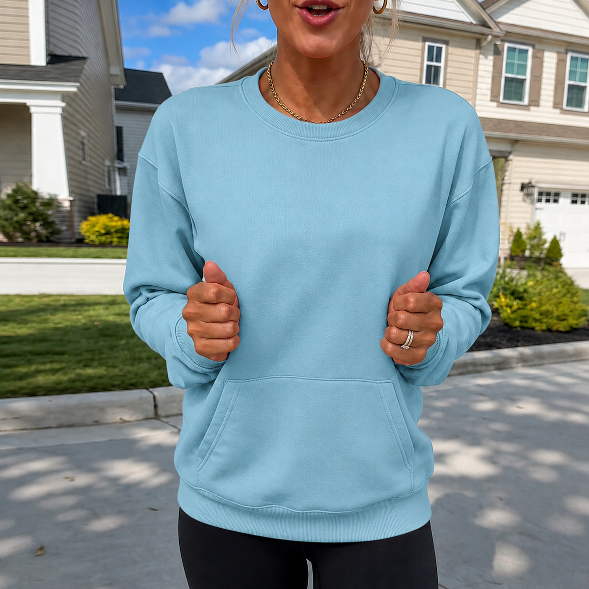 Oversized sky-blue crewneck sweatshirt with kangaroo pocket and ribbed cuffs