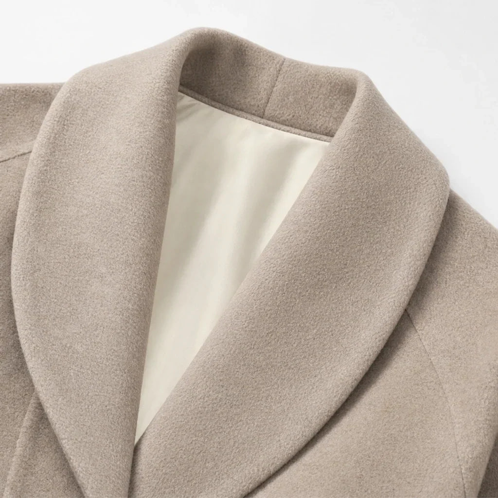 Taupe coat close-up of wide lapels and light interior lining.