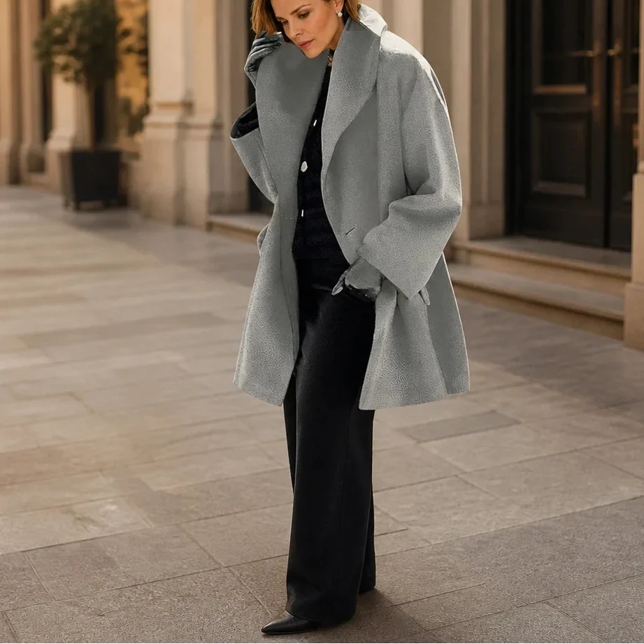 Gray oversized coat with wide lapels and a relaxed, mid-thigh cut
