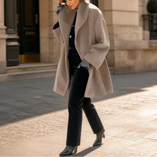 Taupe oversized coat with wide lapels, long sleeves, and a flared hem