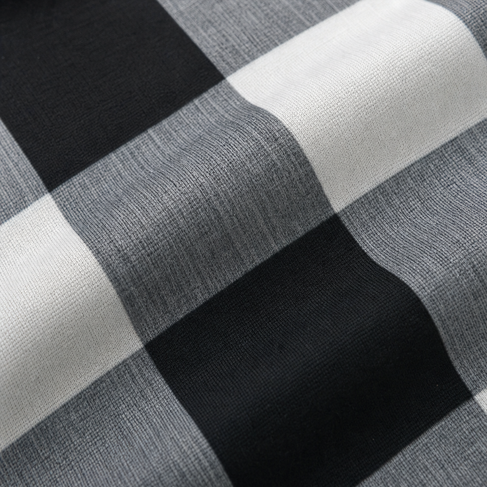 Plaid fabric panel in black, white, and gray check pattern