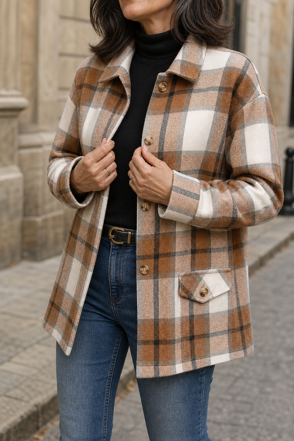 Brown plaid shirt jacket with button front, collar, chest pockets, long sleeves.