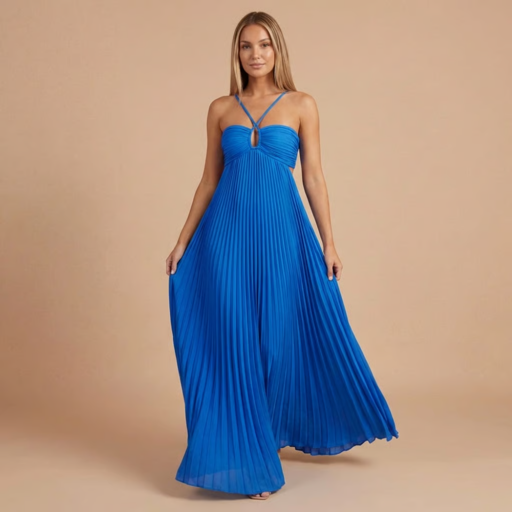 Royal blue pleated halter maxi dress with cross-strap neckline and flowing skirt