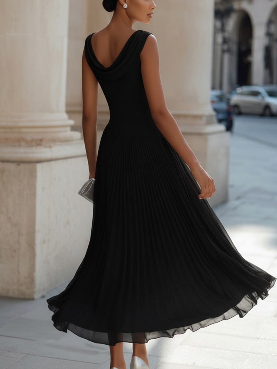Black pleated midi dress with draped neckline, sleeveless back and flowing skirt