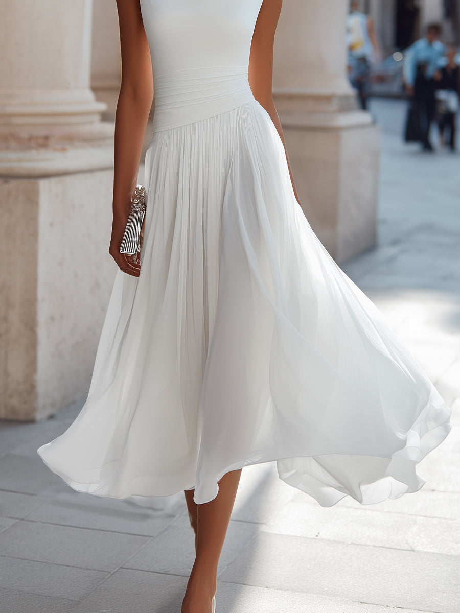 White pleated midi dress with draped neckline, sleeveless and layered flowing skirt
