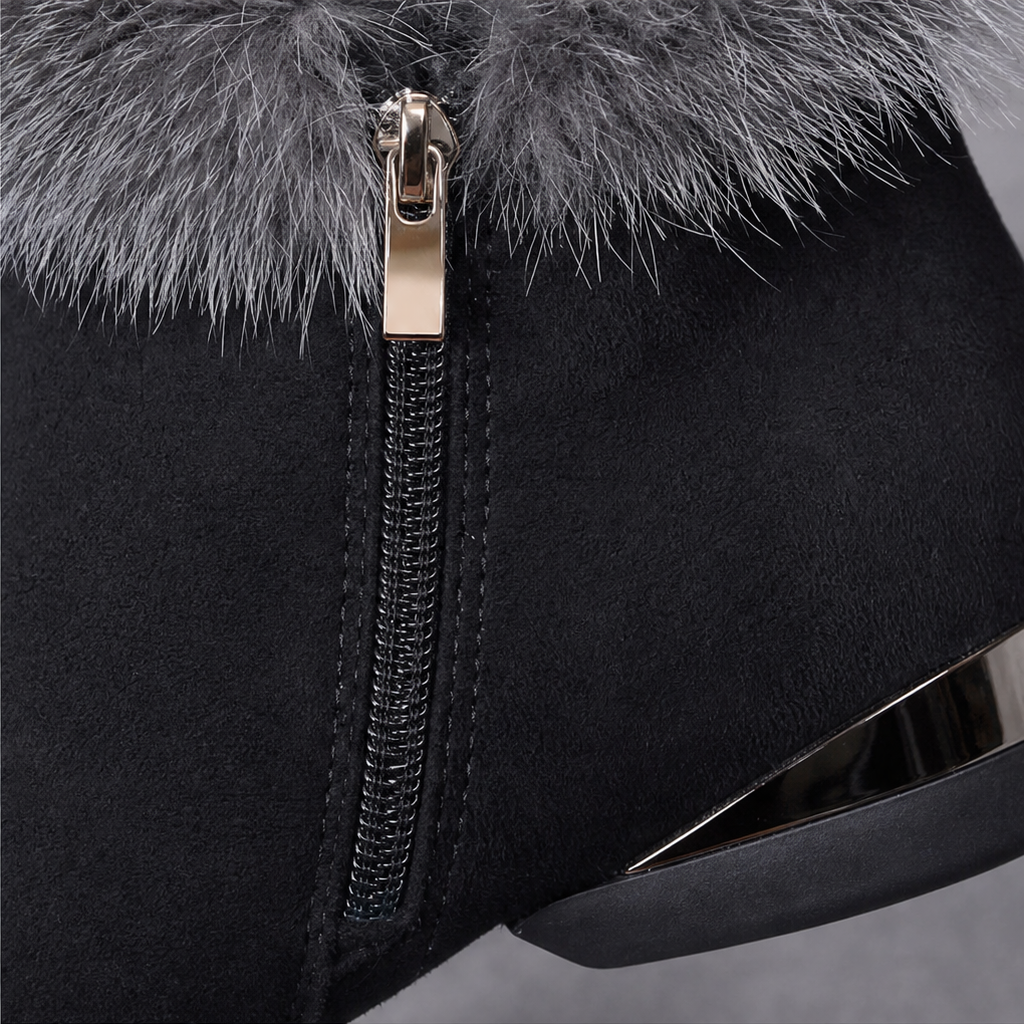 Black ankle boot with faux-fur cuff and side zipper close-up