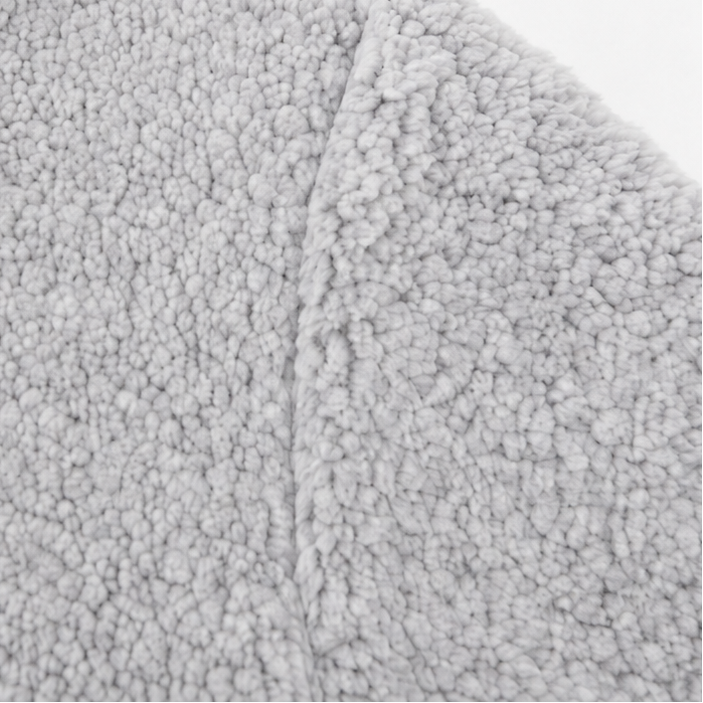Light grey plush knit cardigan fabric close-up
