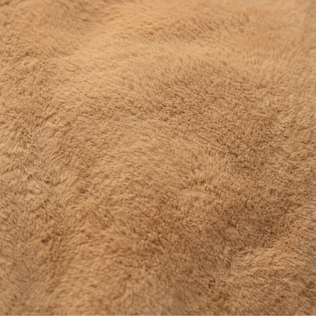 Tan/beige plush fabric texture close-up for a plush-lined hooded vest.