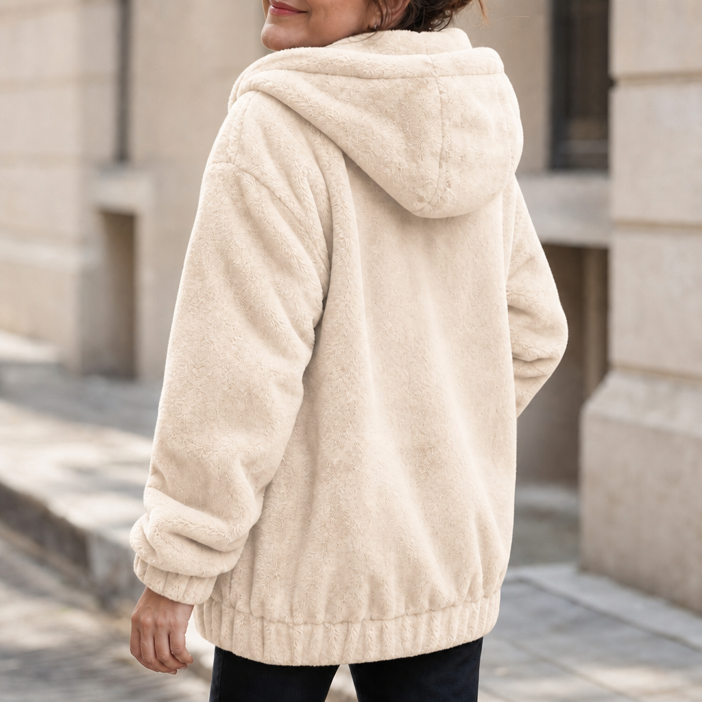 Cream plush-lined hooded vest with front kangaroo pocket and soft teddy fleece cuffs