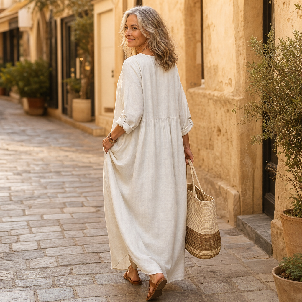 White maxi dress back view with gathered waist seam and 3/4 sleeves
