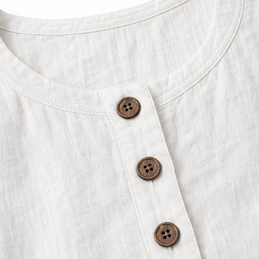 White dress neckline close-up with three button placket