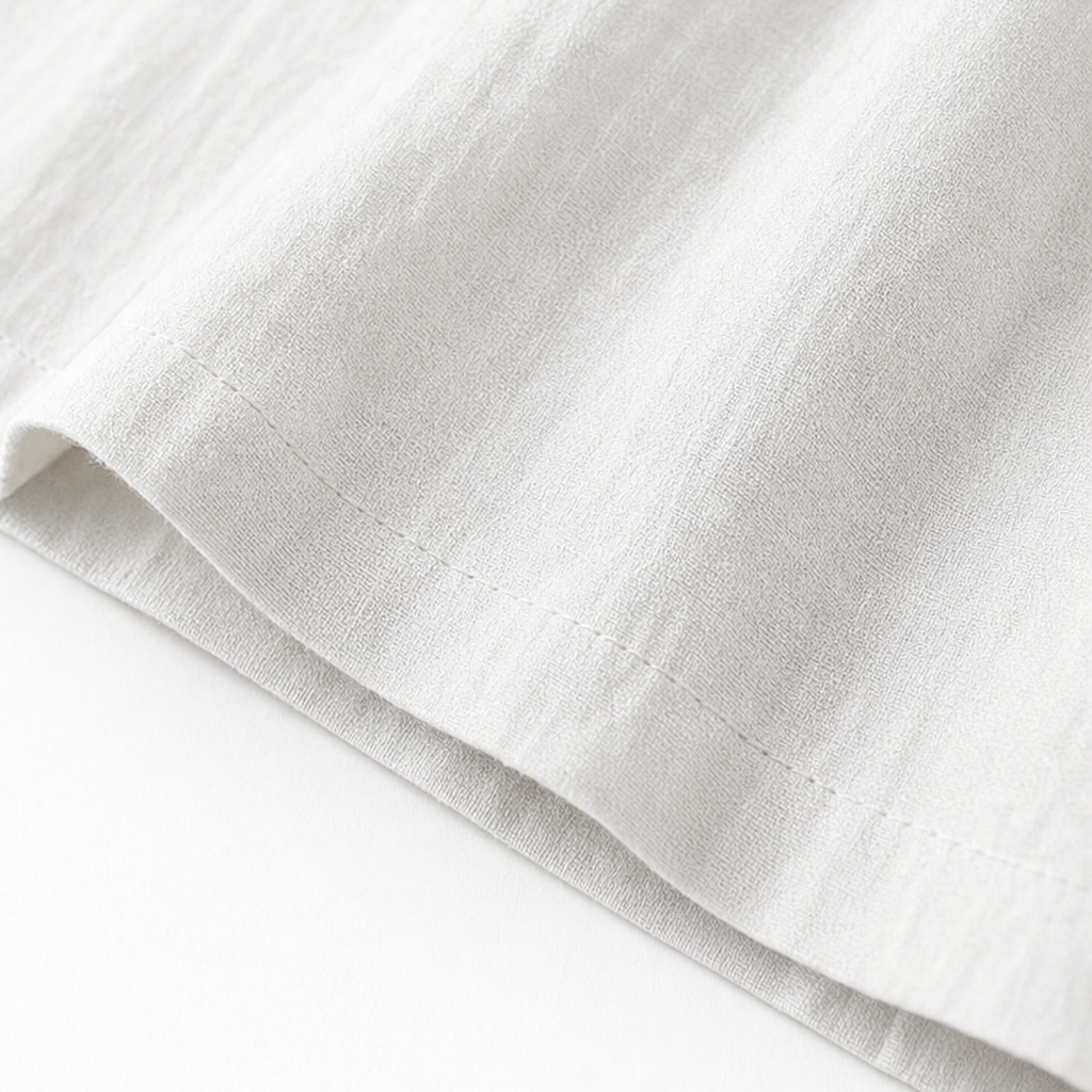 White maxi dress hem and stitched fold detail