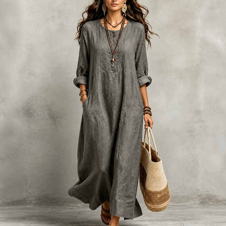 Grey maxi dress with round neckline, 3/4 sleeves, button placket, and side pockets