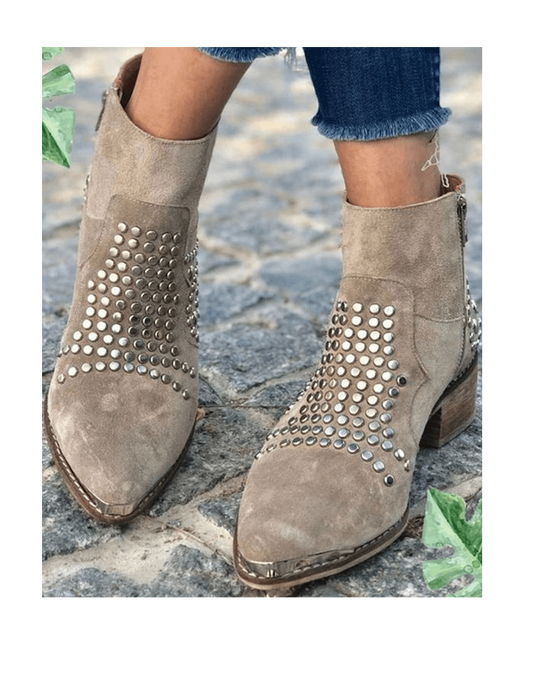 Gray suede pointed-toe ankle boots with dense silver studs on sides and low block heel