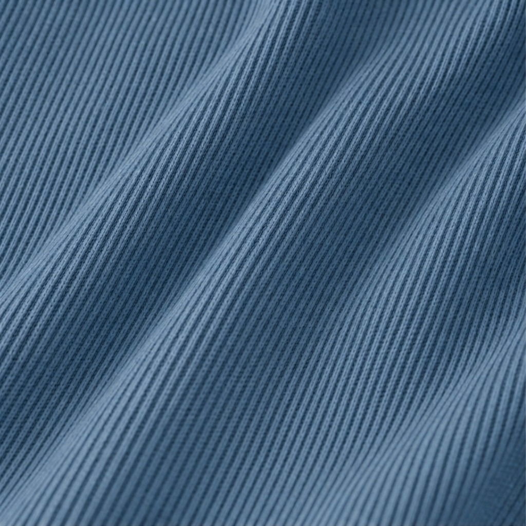 Close-up of blue ribbed knit fabric texture on long-sleeve V-neck shirt