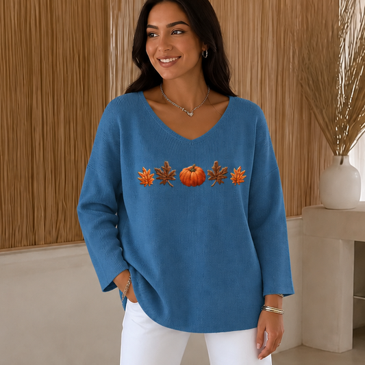 Blue V-neck long-sleeve knit shirt with orange pumpkin and leaf print, full front view