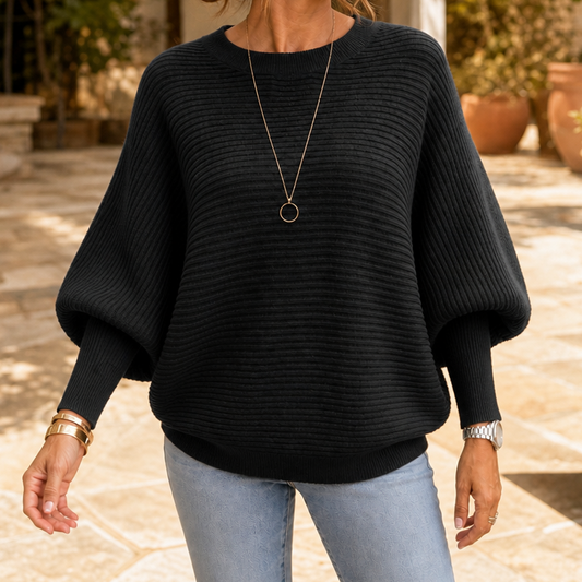 Black ribbed dolman-sleeve knit sweater with crew neck and wide sleeves