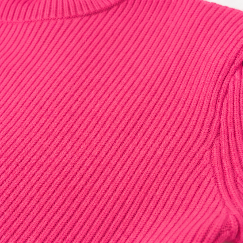 Close-up of ribbed knit fabric on a crew-neck bodycon sweater dress, bright pink