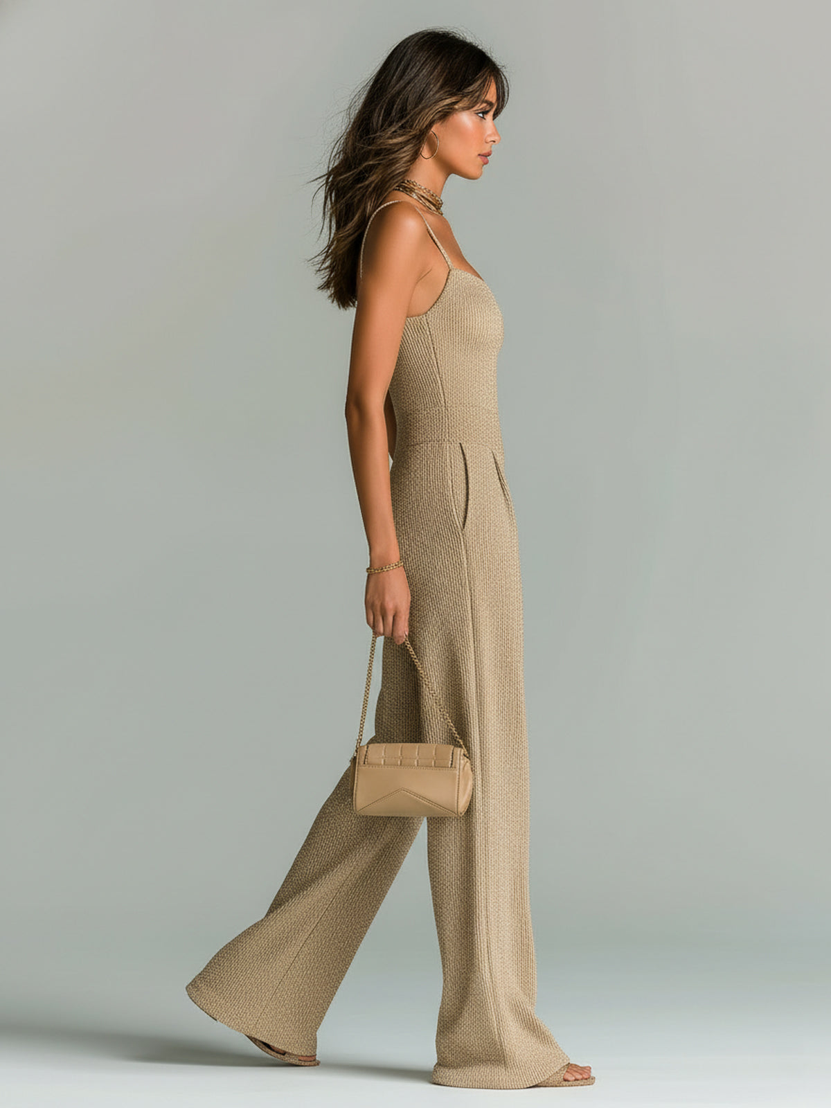 Beige ribbed knit wide-leg jumpsuit, side view, with spaghetti straps