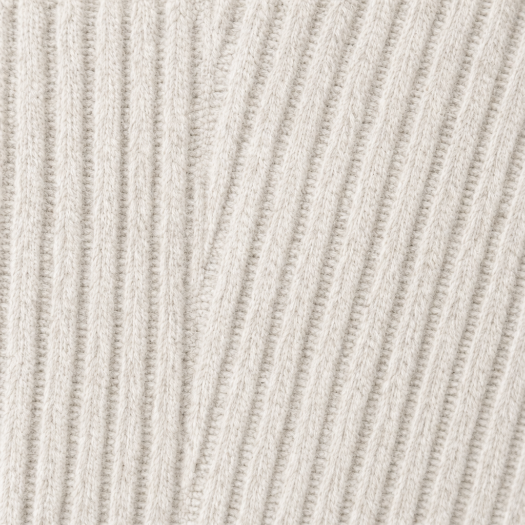 Close-up of light cream ribbed knit texture for an open-front cardigan