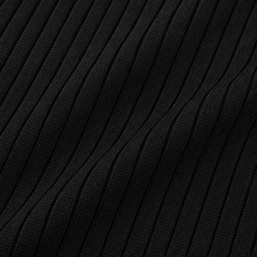Close-up of black ribbed knit fabric texture for a fitted sweater top