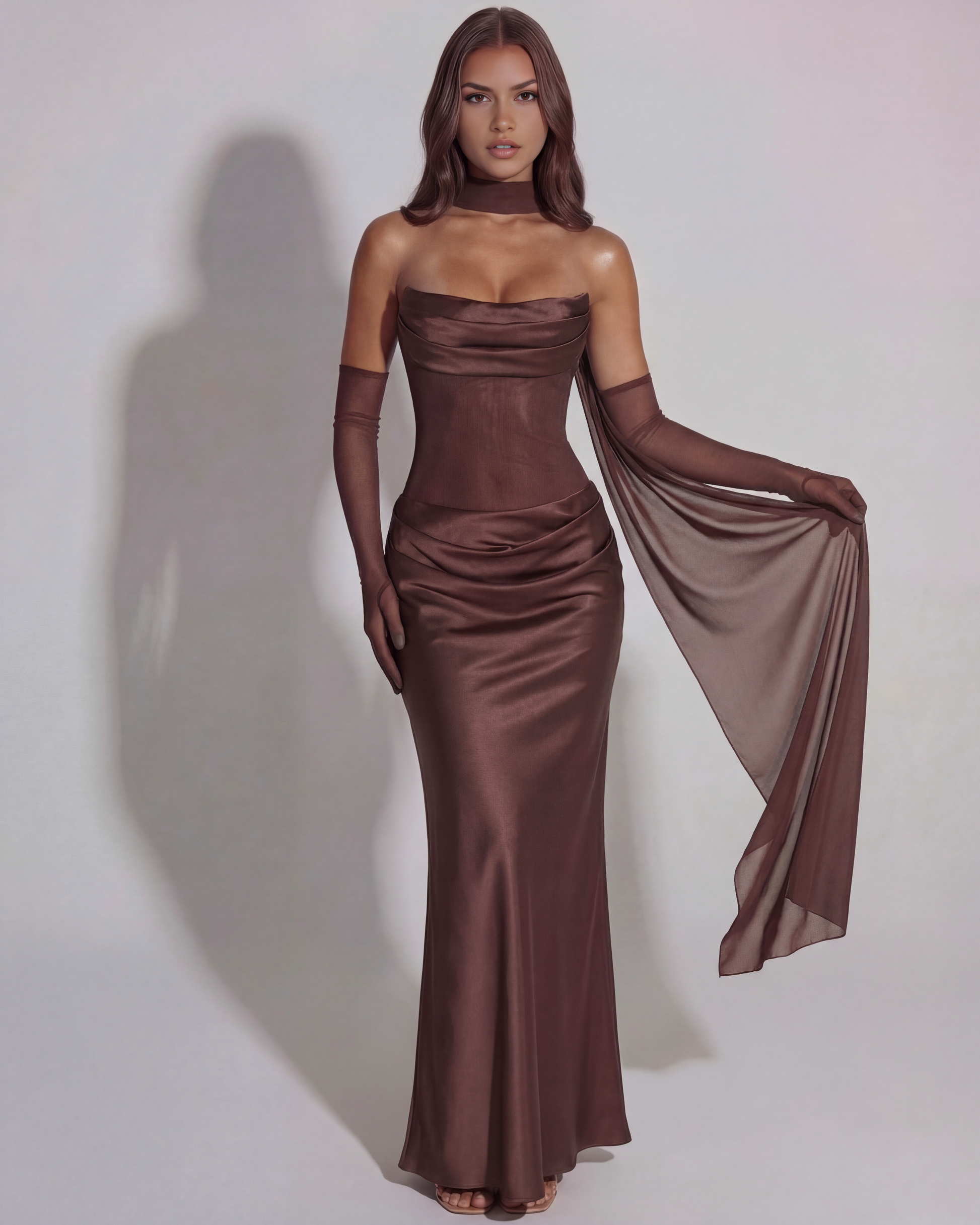 Brown satin cowl neck maxi dress with draped side fabric and ruched bodice