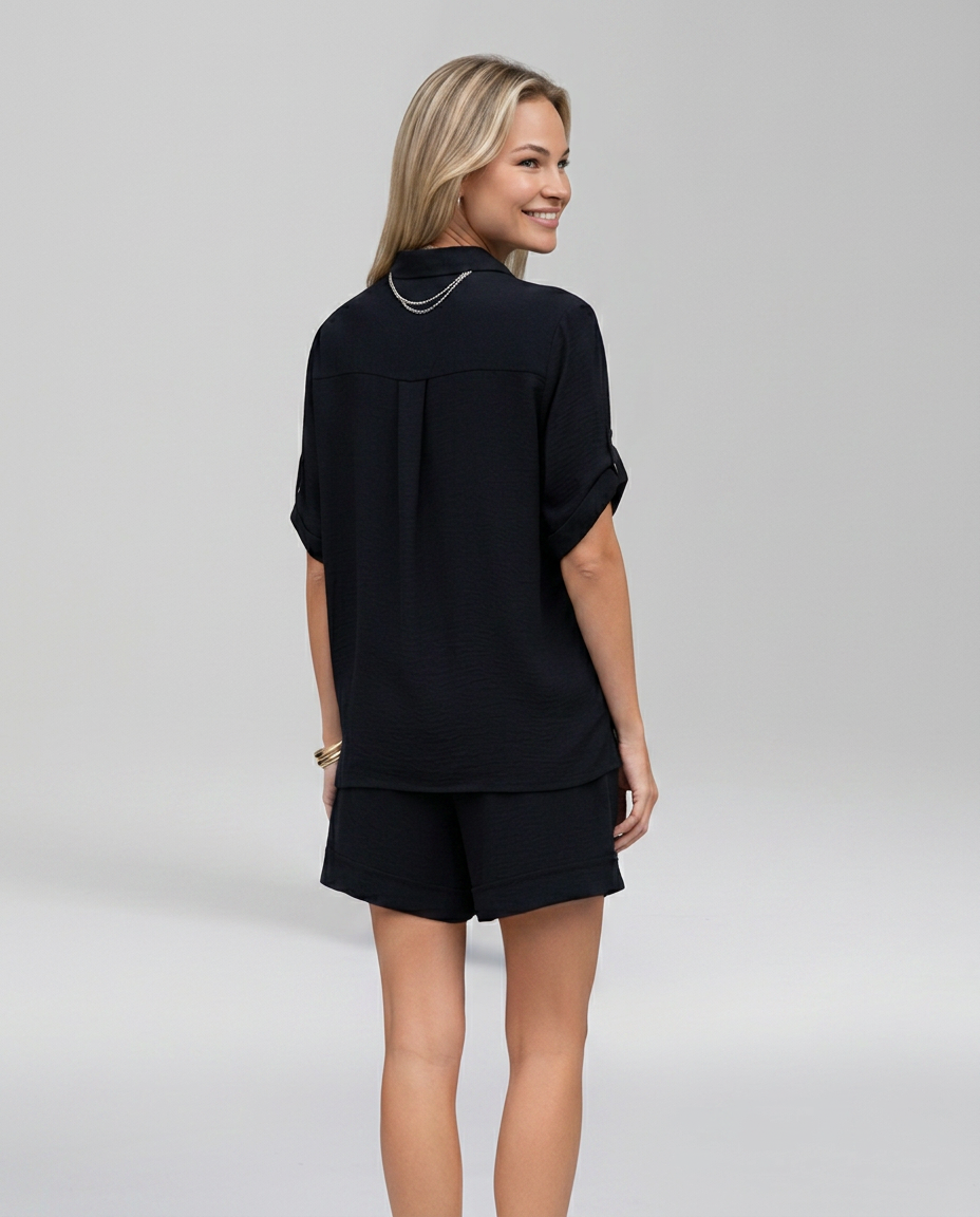 Black short-sleeve collared set from back, relaxed fit, matching shorts