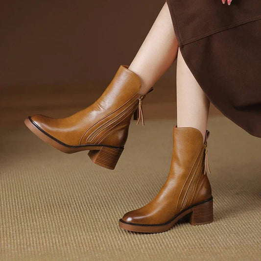 Brown side-zip ankle boots with block heel and tassel zipper pull