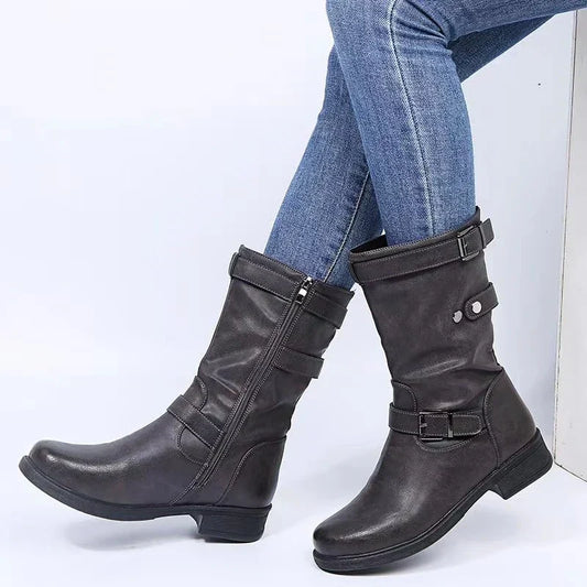 Dark gray ankle boots with buckle straps and cushioned shaft padding
