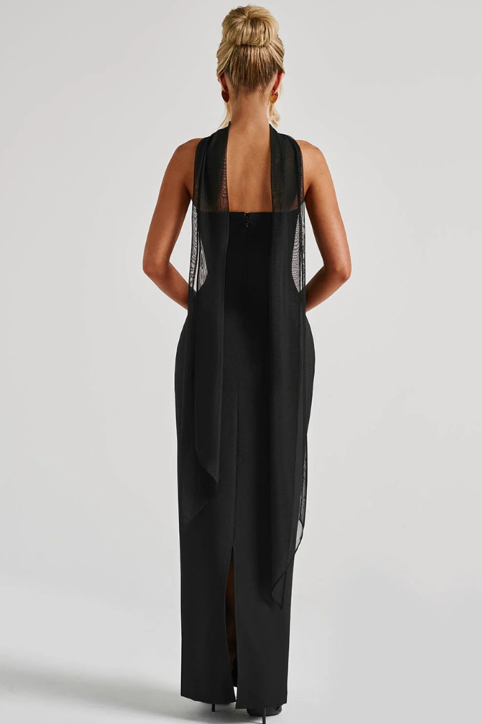 Black strapless bodycon maxi dress with open back and flowing side scarf