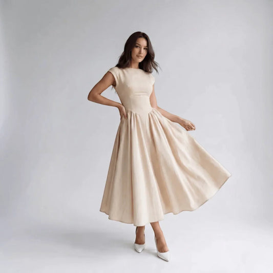 Beige sleeveless fit-and-flare midi dress, side view with flared pleated hem