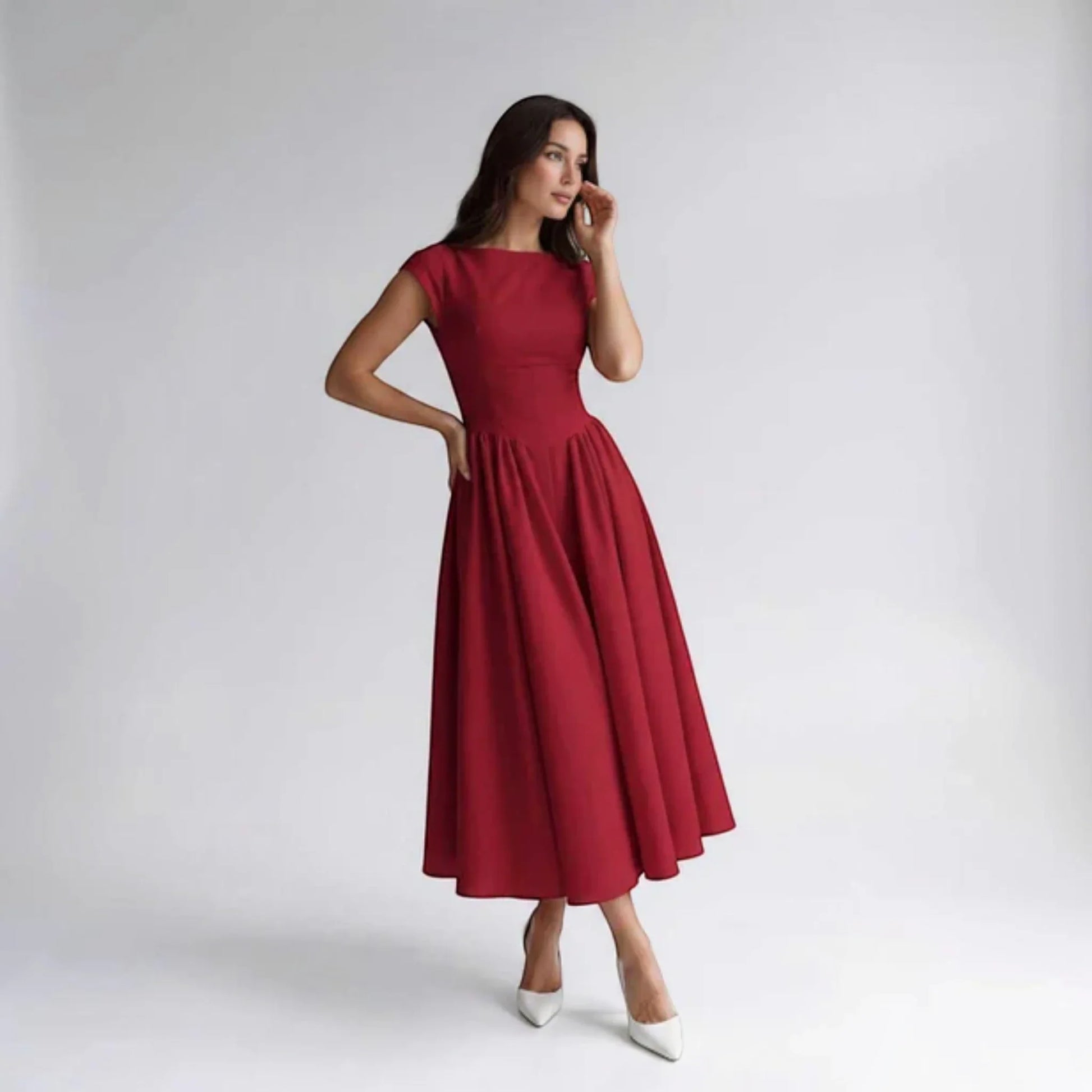 Red sleeveless fit-and-flare midi dress with round neckline and gathered waist