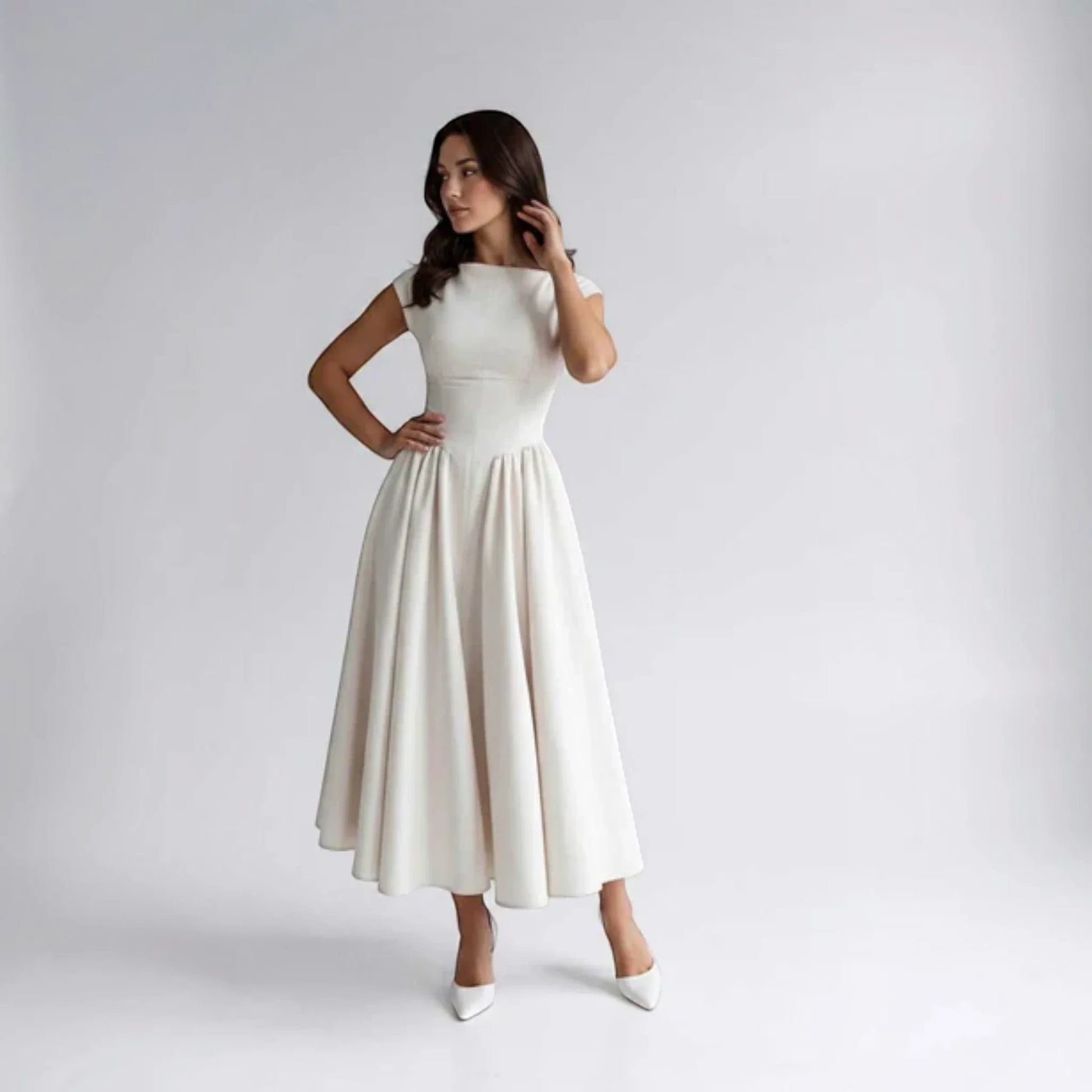 Beige sleeveless fit-and-flare midi dress with fitted bodice and pleated skirt