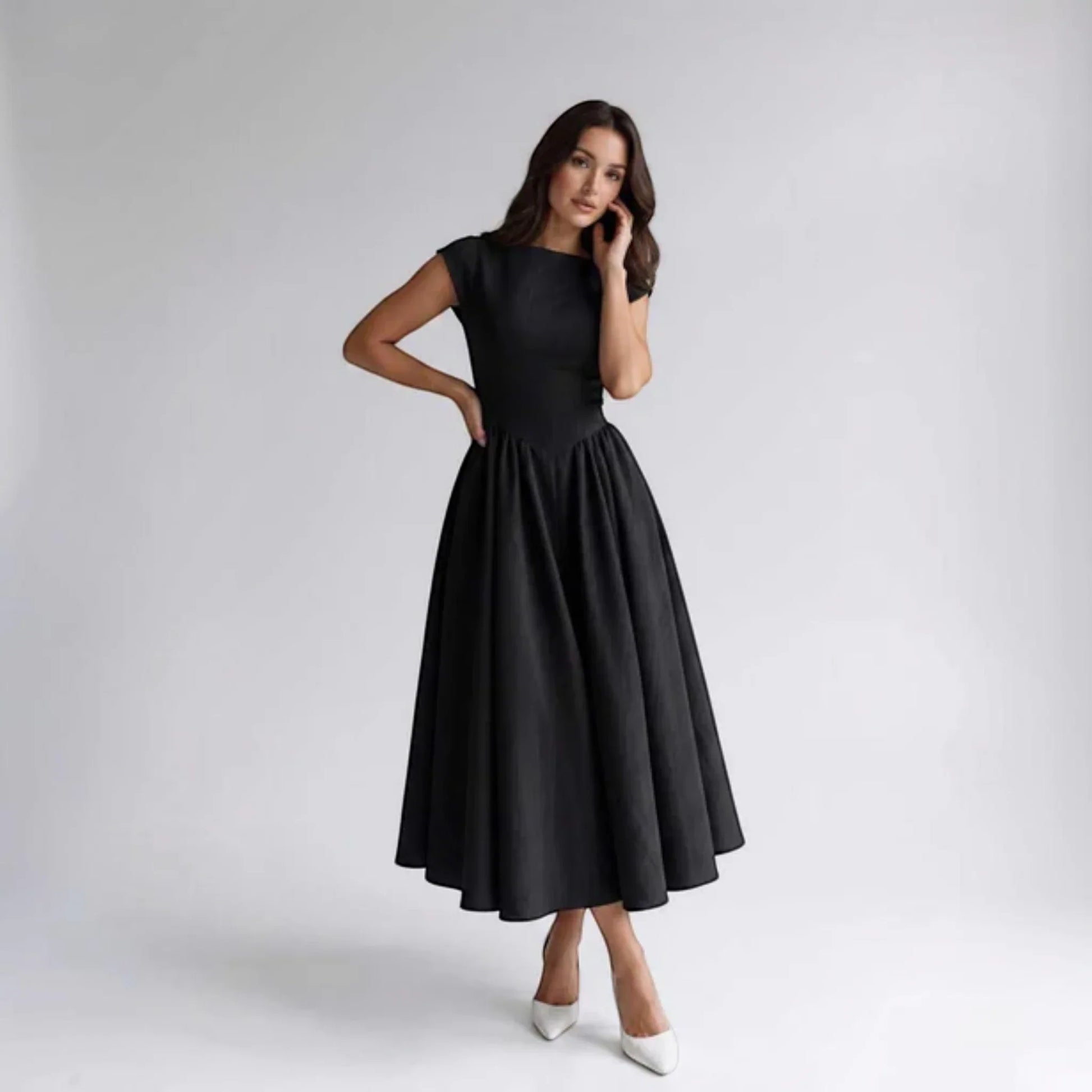 Black sleeveless fit-and-flare midi dress with round neckline and gathered skirt