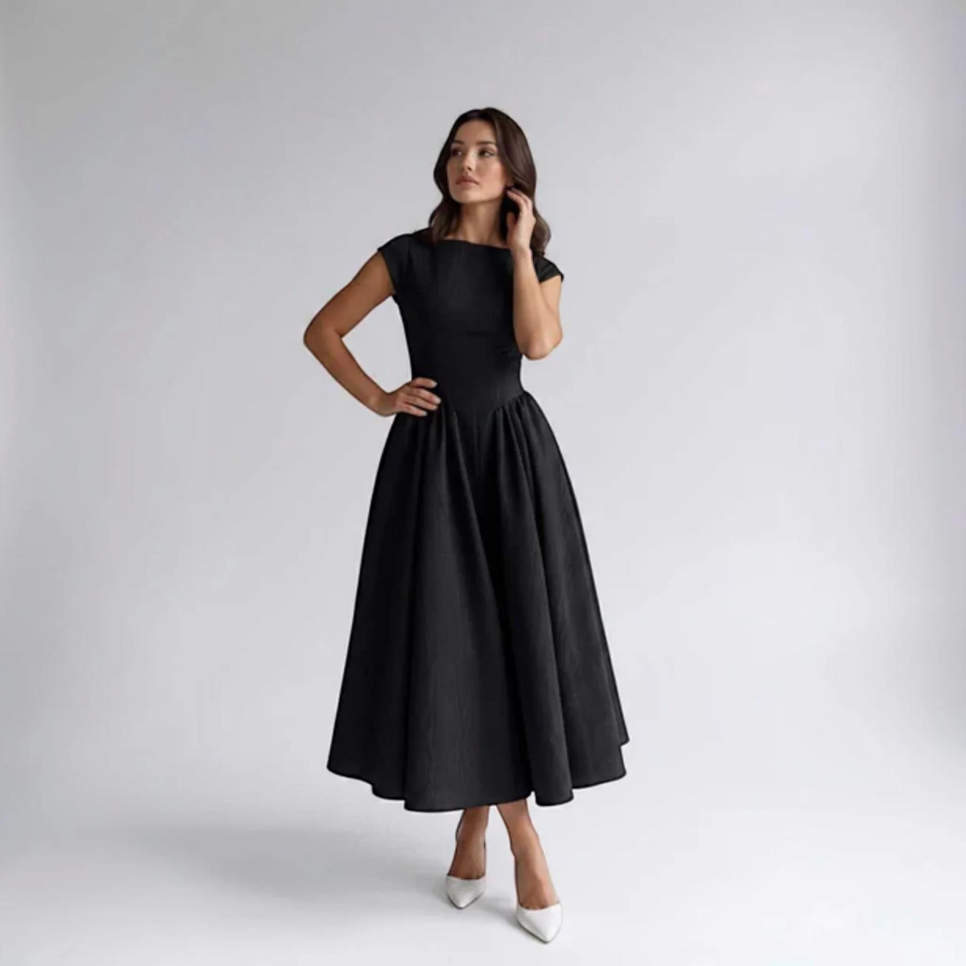 Black sleeveless fit-and-flare midi dress with round neckline and fitted bodice