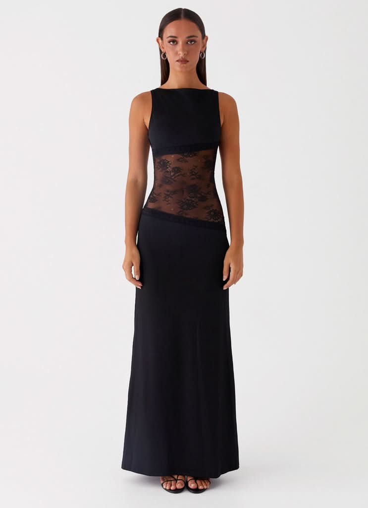 Black sleeveless lace cutout maxi dress with sheer midsection