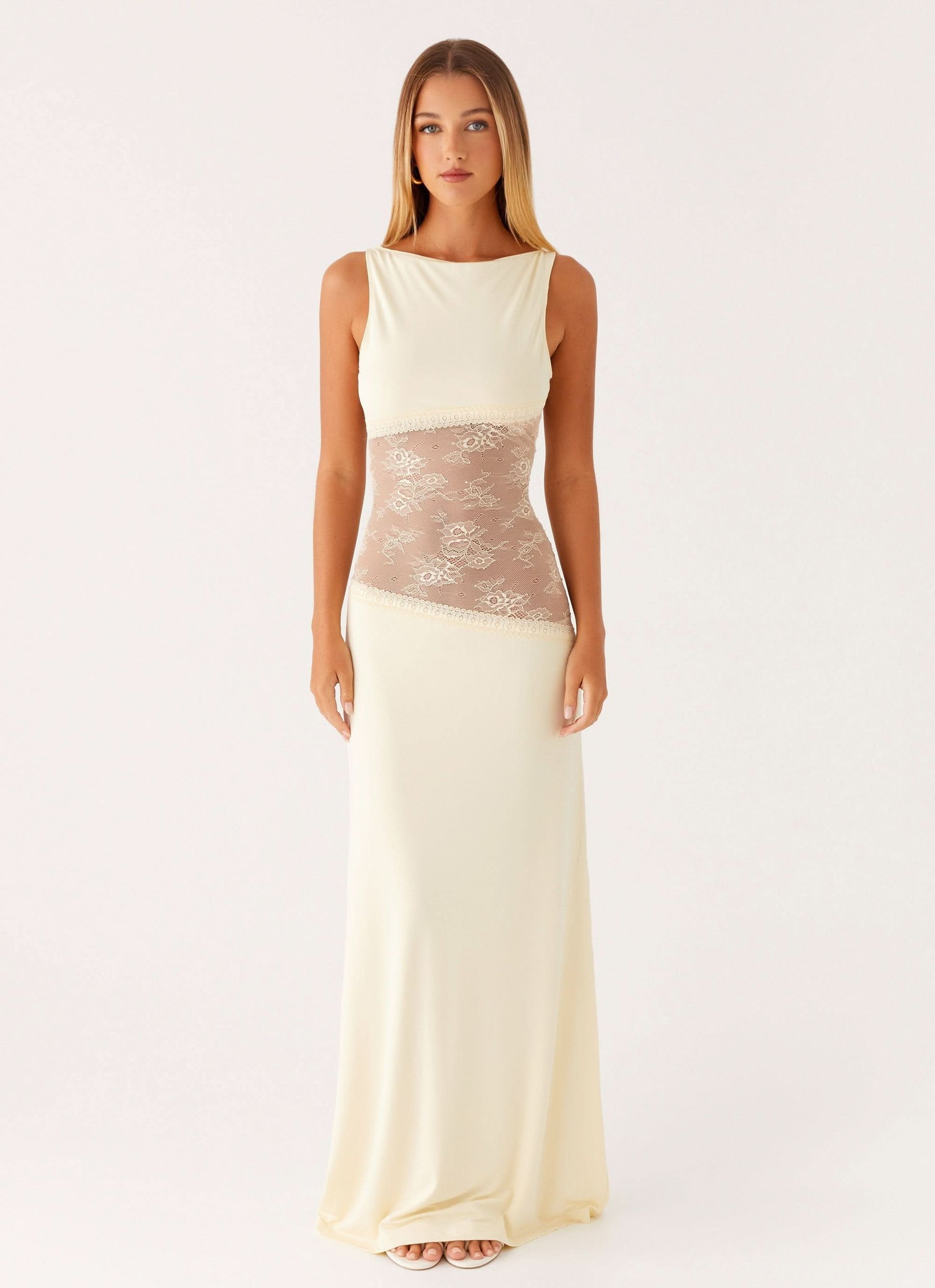 Cream sleeveless lace cutout maxi dress with sheer lace waist panel