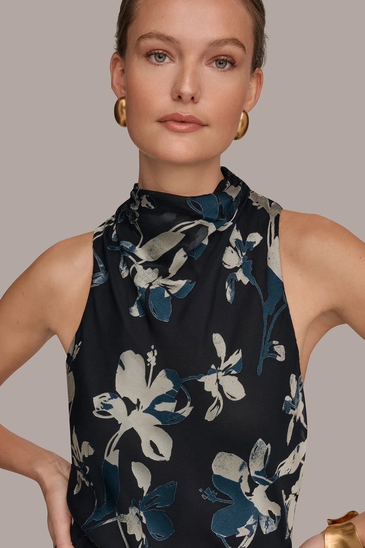 Sleeveless high-neck midi dress in dark navy with large floral burnout detail