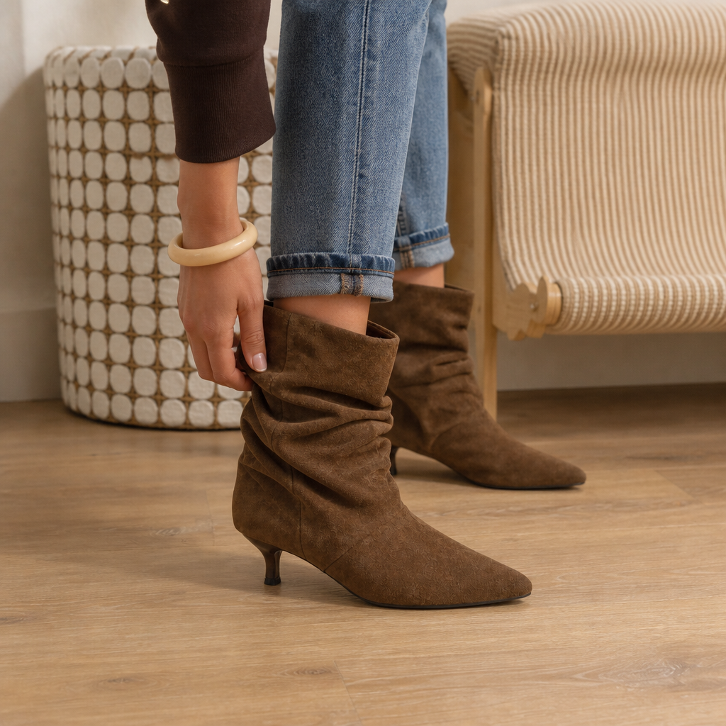 Slouchy suede pointed-toe ankle boots in dark brown with ruched shaft and low heel
