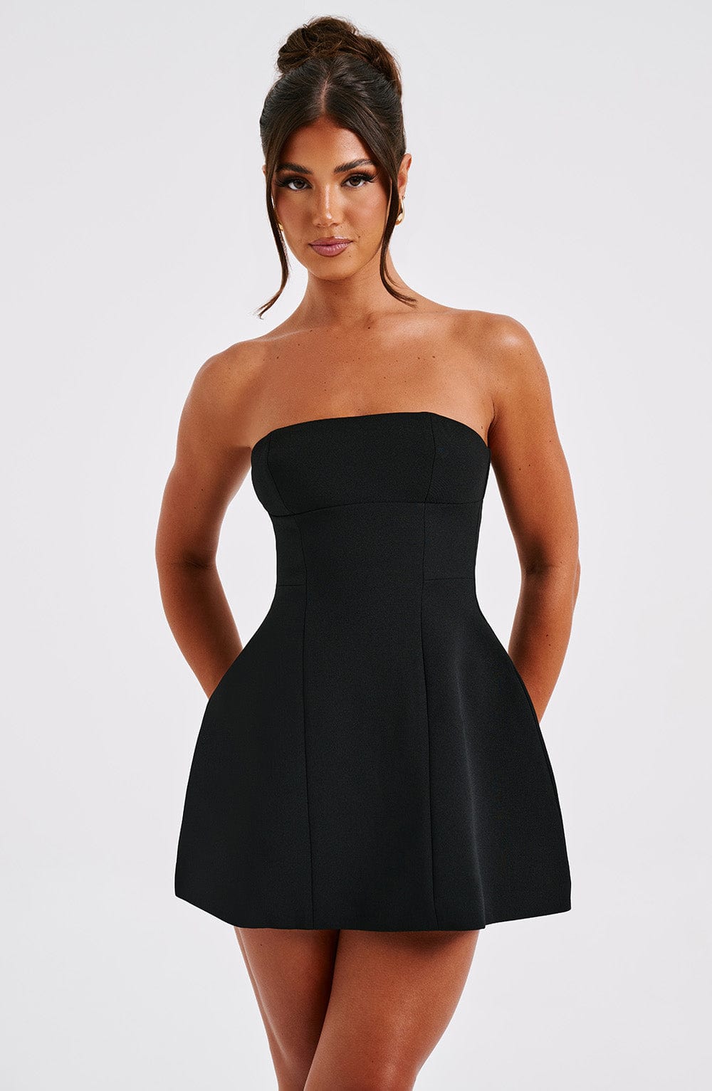 Black strapless bubble mini dress with seamed bodice and flared skirt