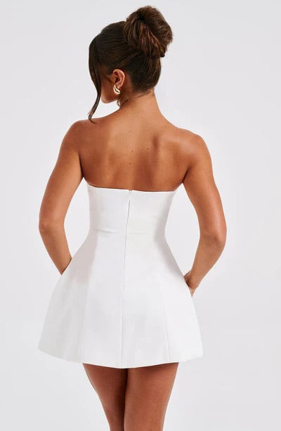 White strapless bubble mini dress with seamed bodice and flared skirt
