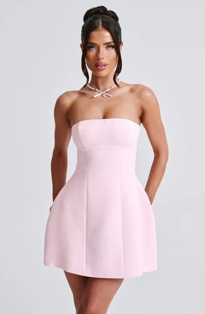 Pink strapless bubble mini dress with crossed-back detail and flared skirt