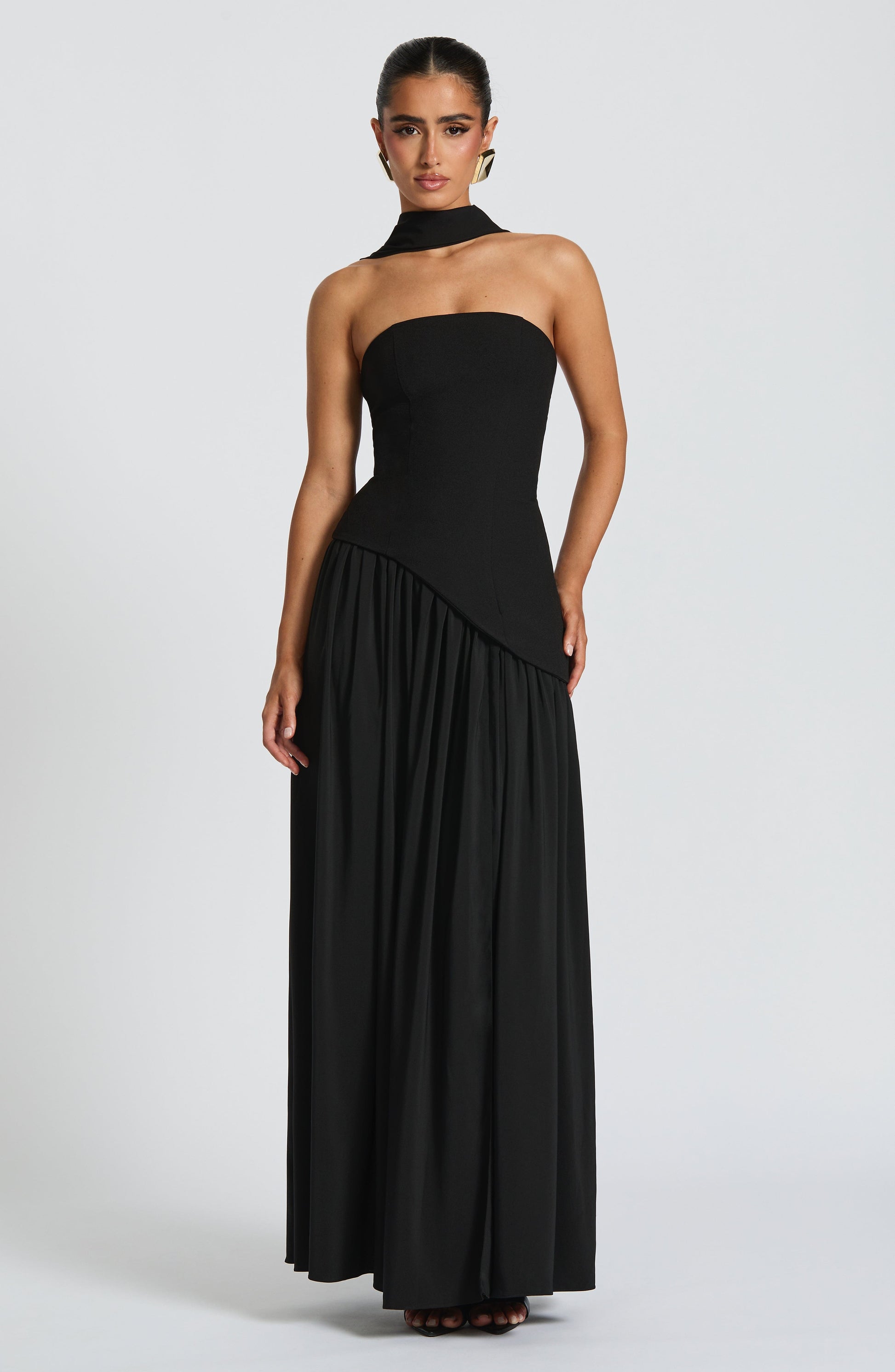 Black strapless maxi dress with side slit and gathered skirt detail
