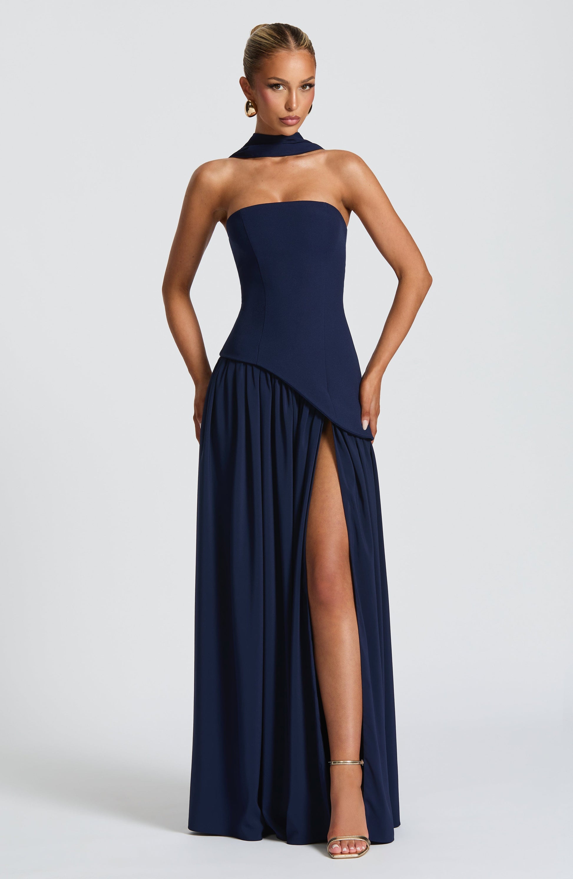 Dark blue strapless maxi dress with side slit and gathered skirt detail