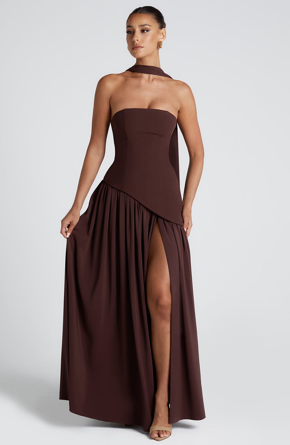 Dark red strapless maxi dress with side slit and gathered skirt detail