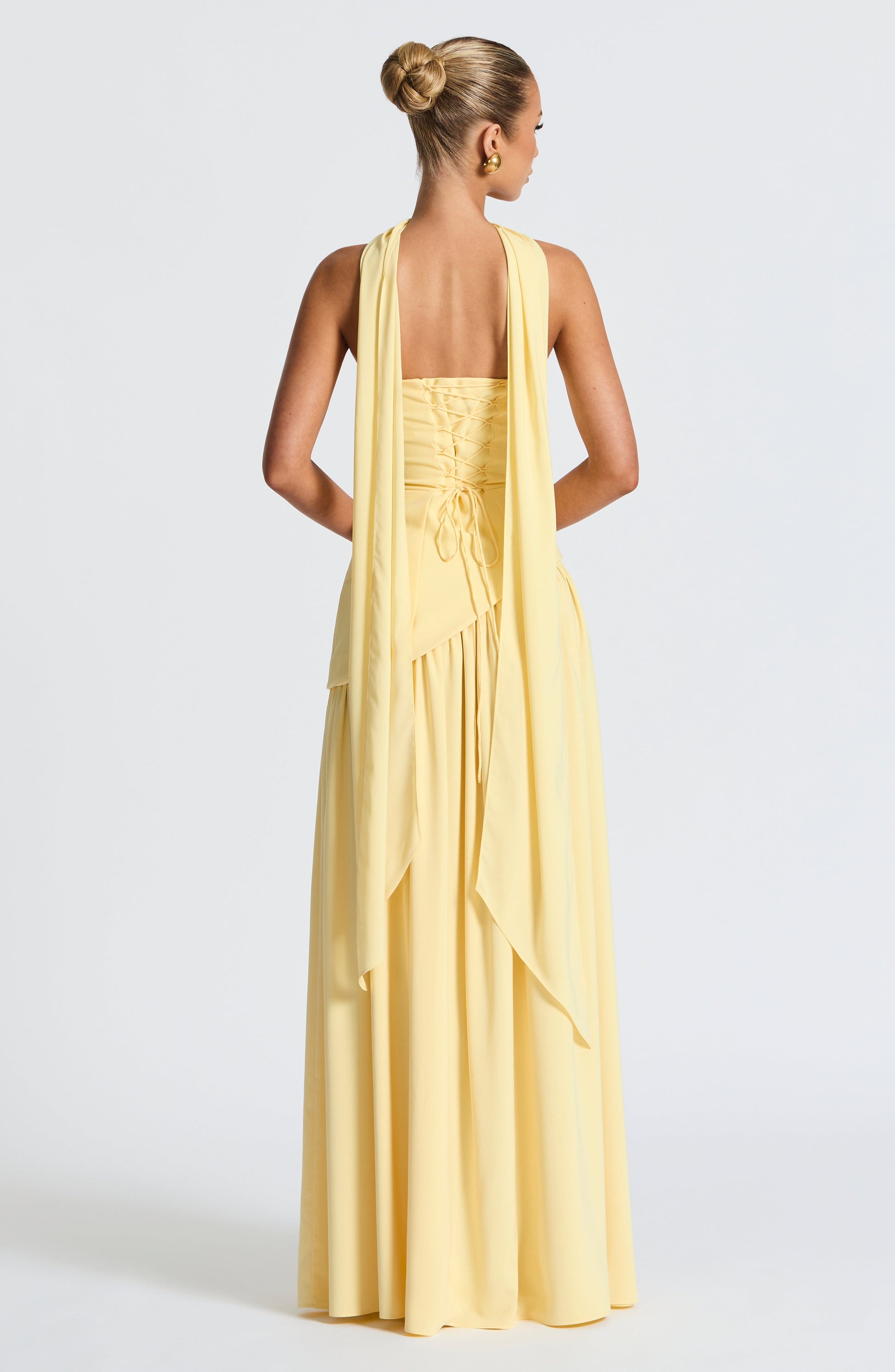 Butter yellow strapless maxi dress with open-back drape and gathered skirt