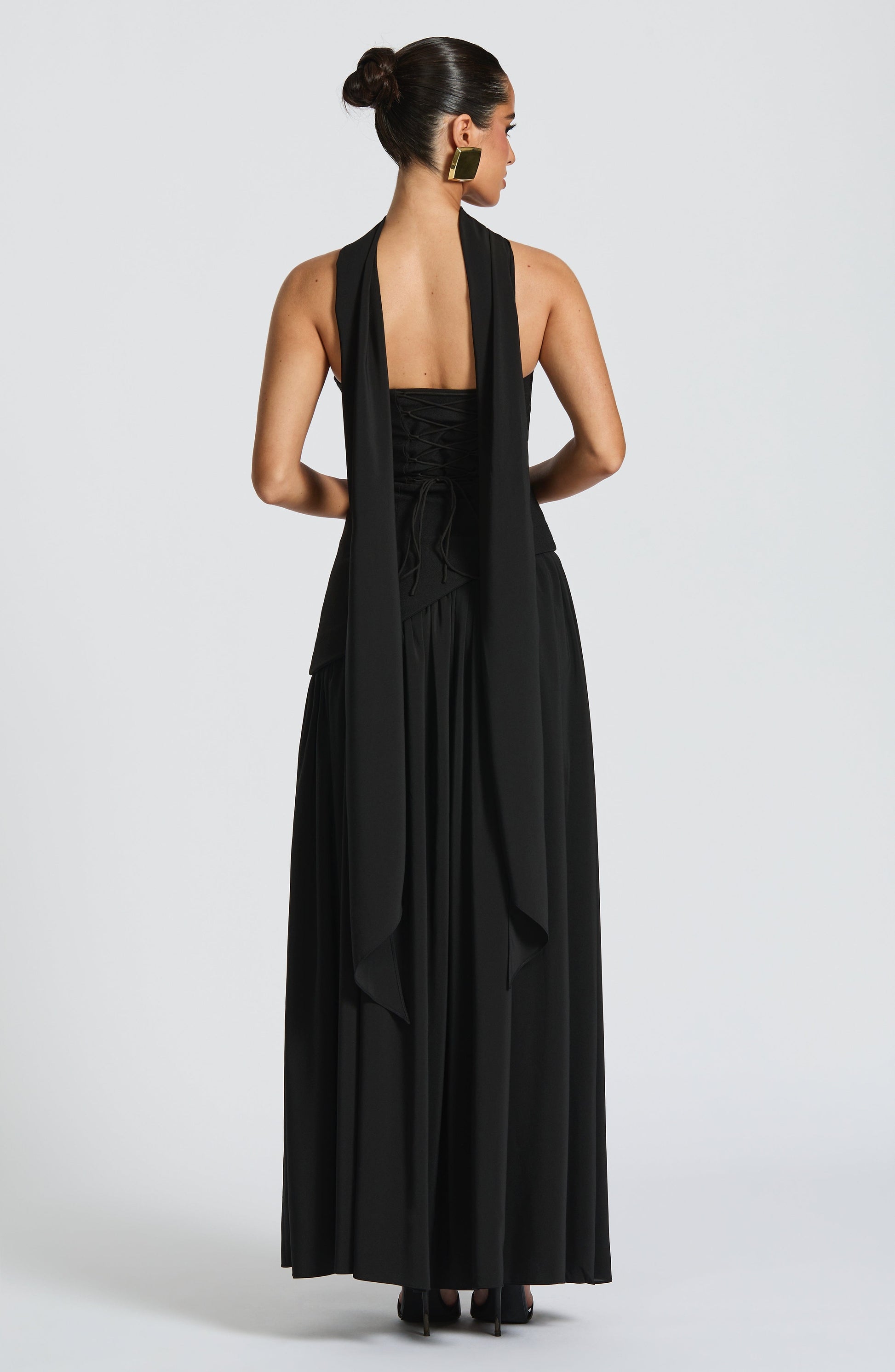 Black strapless maxi dress with draped bodice and side slit